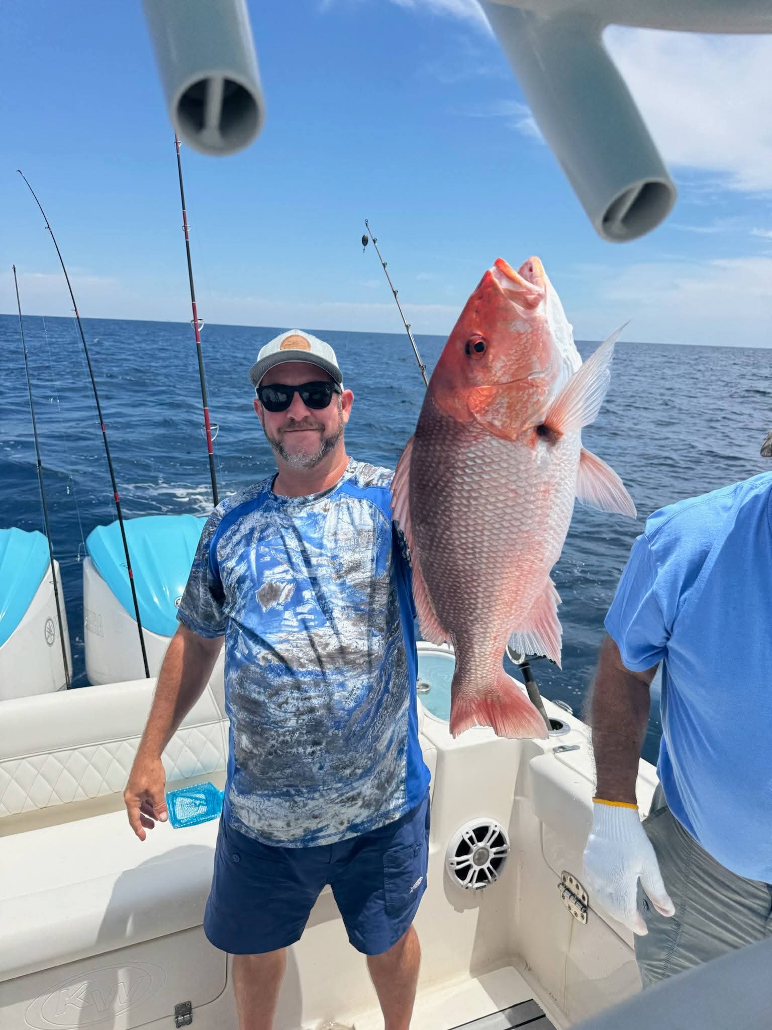 Angler with a big red snapper on the boat
