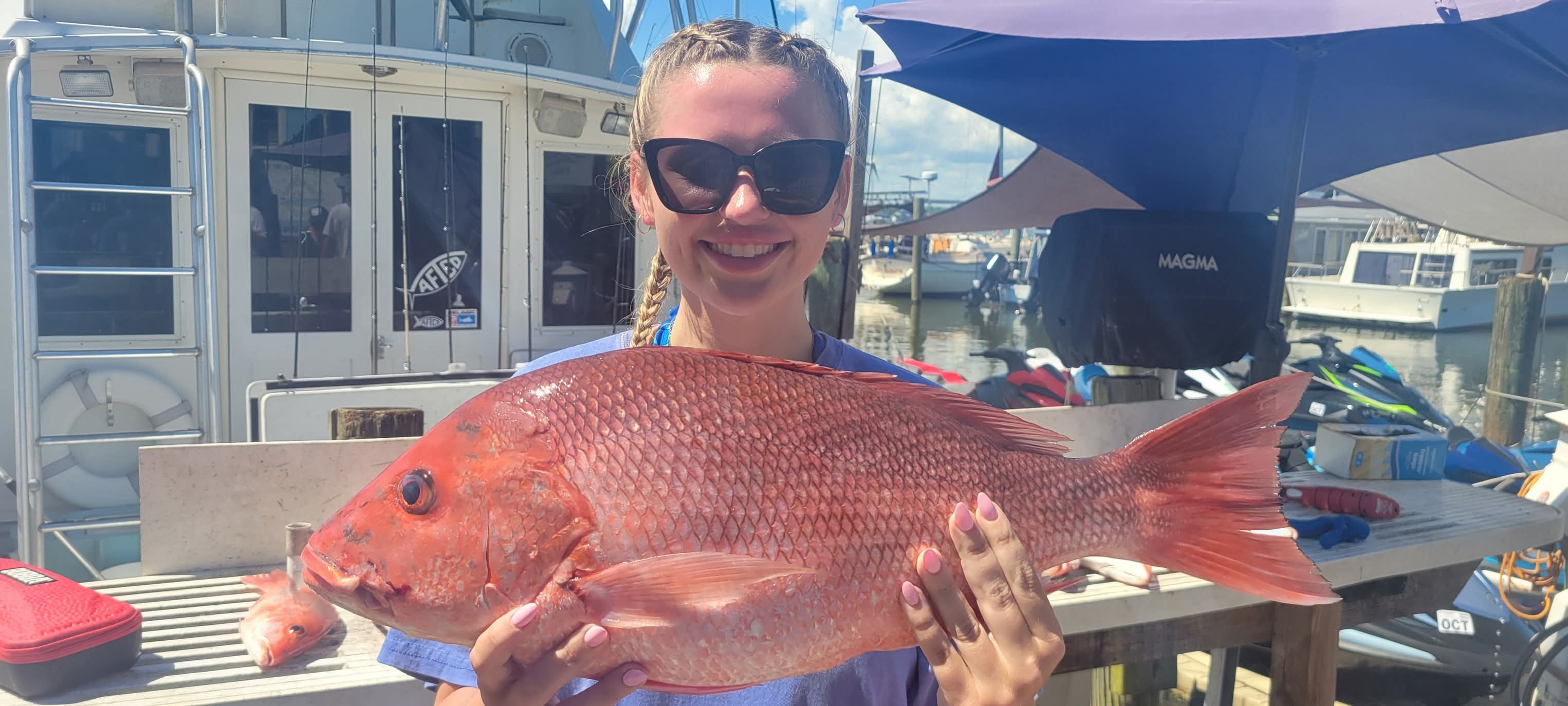 Happy angler with a big red snapper